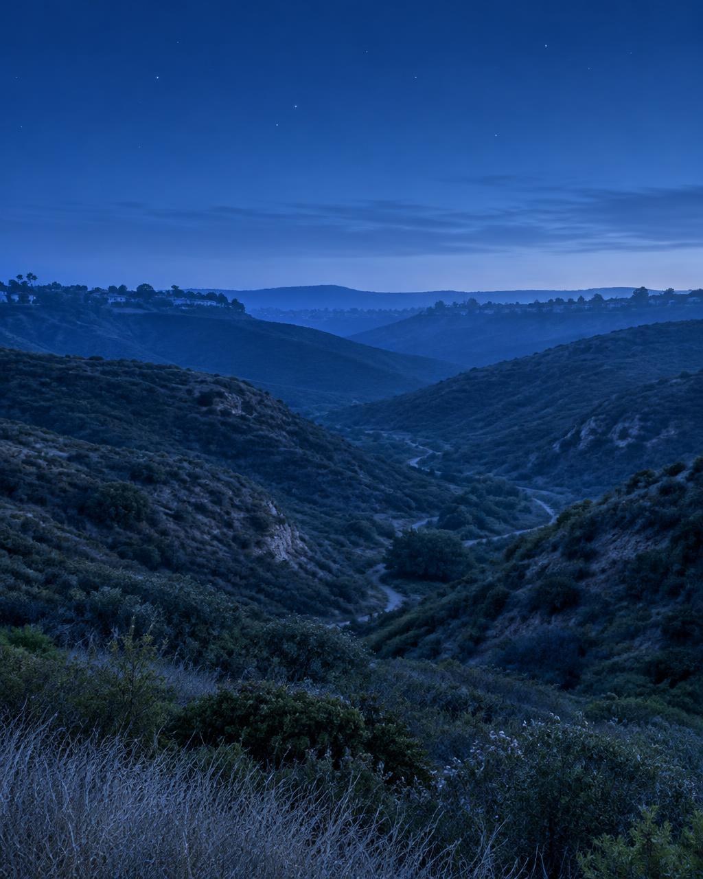 A general San Diego County canyon beneath early stars